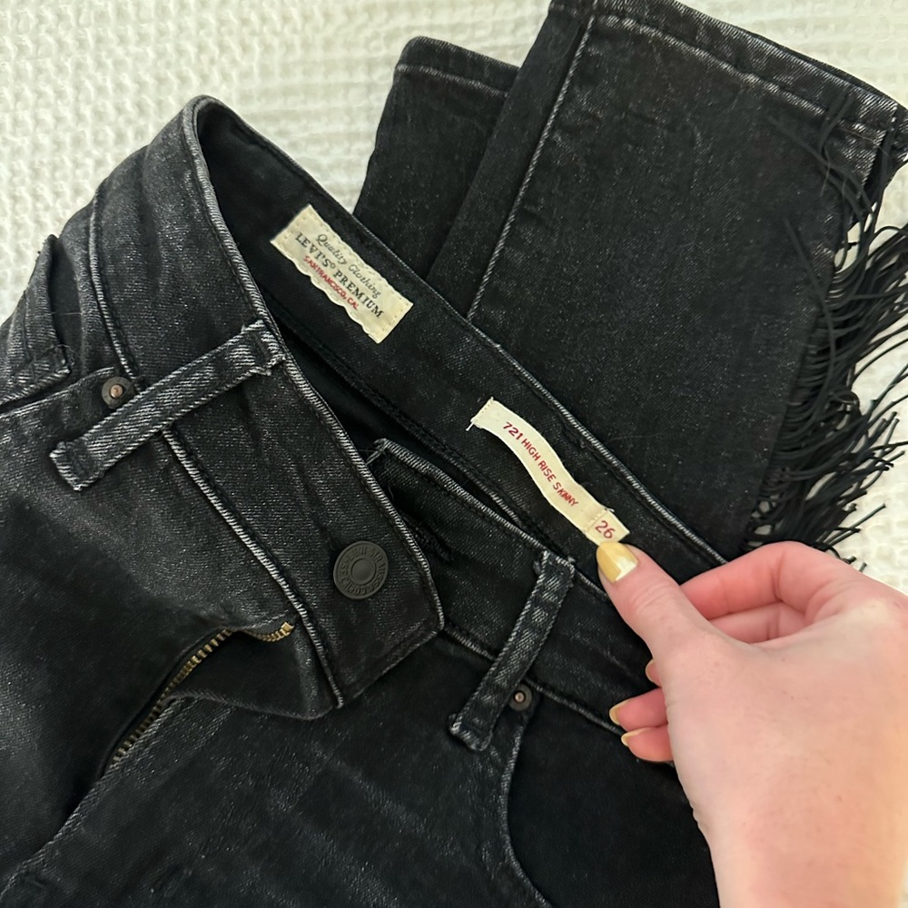 Levi’s black jeans with fringe